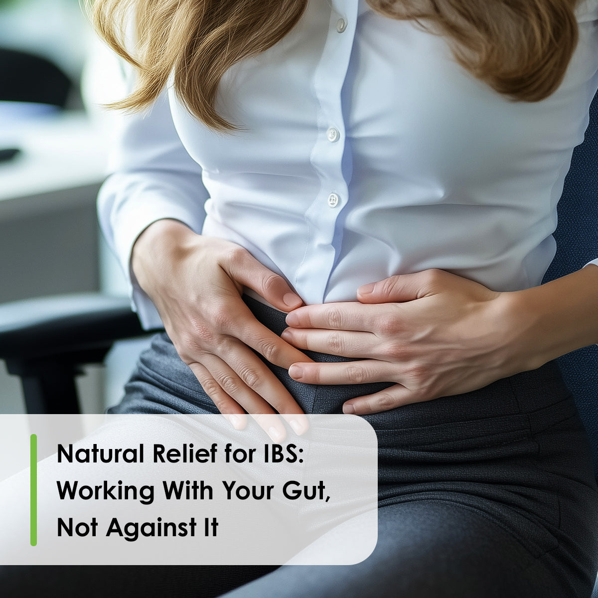 Natural relief for IBS: woman in office holding her midsection